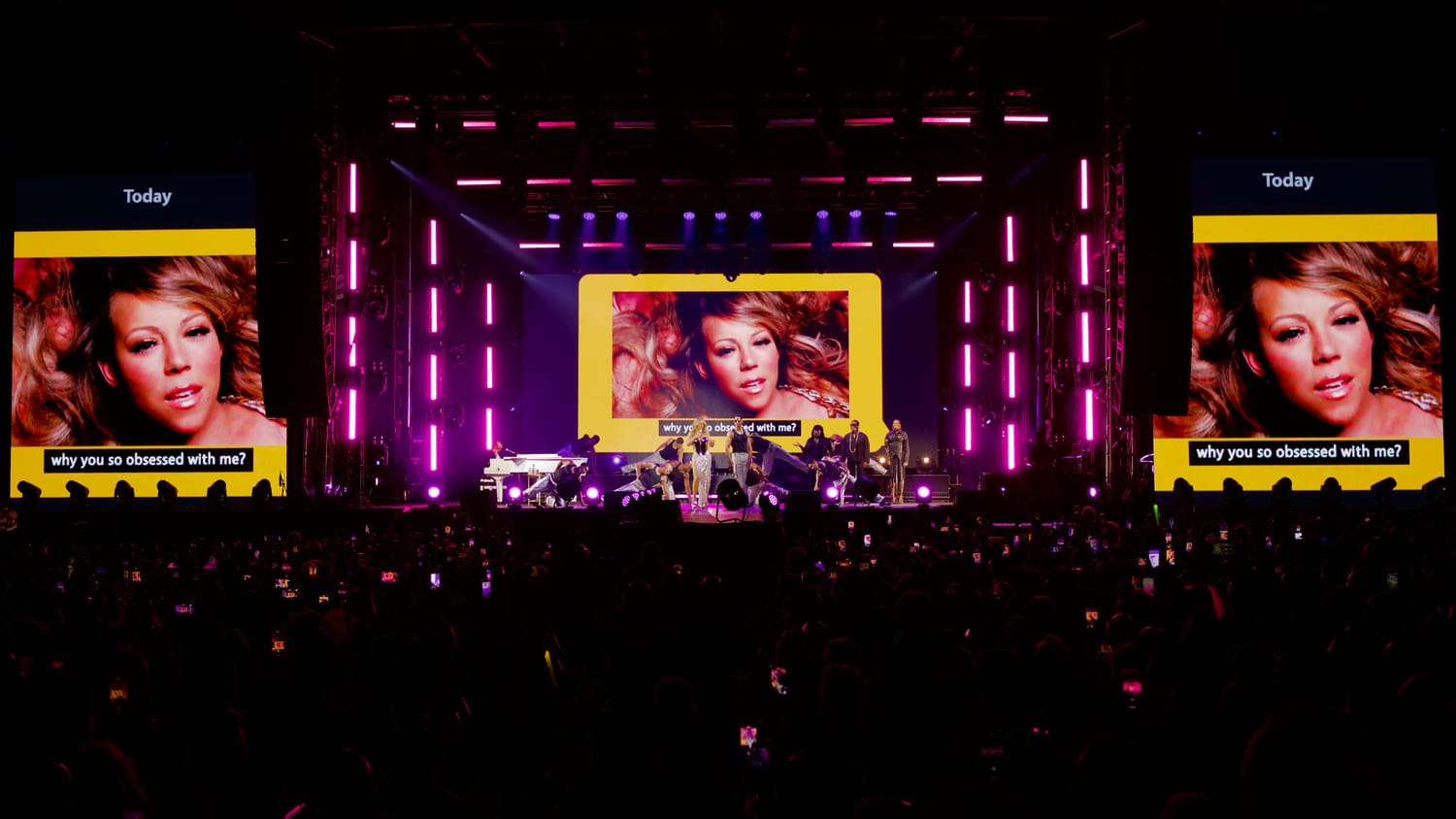 Mariah Carey in close-up on the stage IMAG screens at LA Pride, pink light beams framing the multi-surface LED.